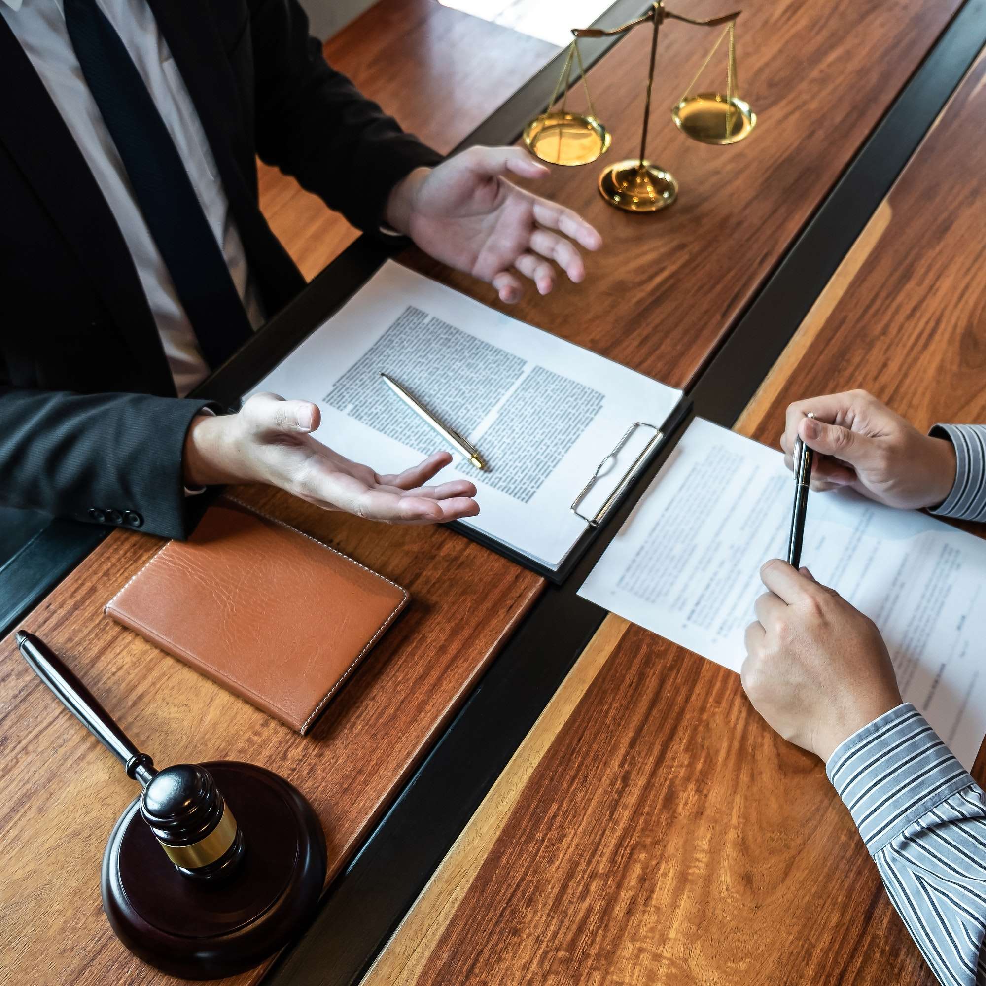 male-lawyer-discussing-negotiation-legal-case-with-client-meeting-with-document-contract-in-office.jpg male-lawyer-discussing-negotiation-legal-case-with-client-meeting-with-document-contract-in-office.jpg
